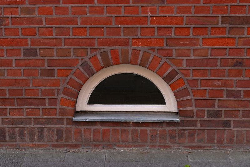 Arched window fitting